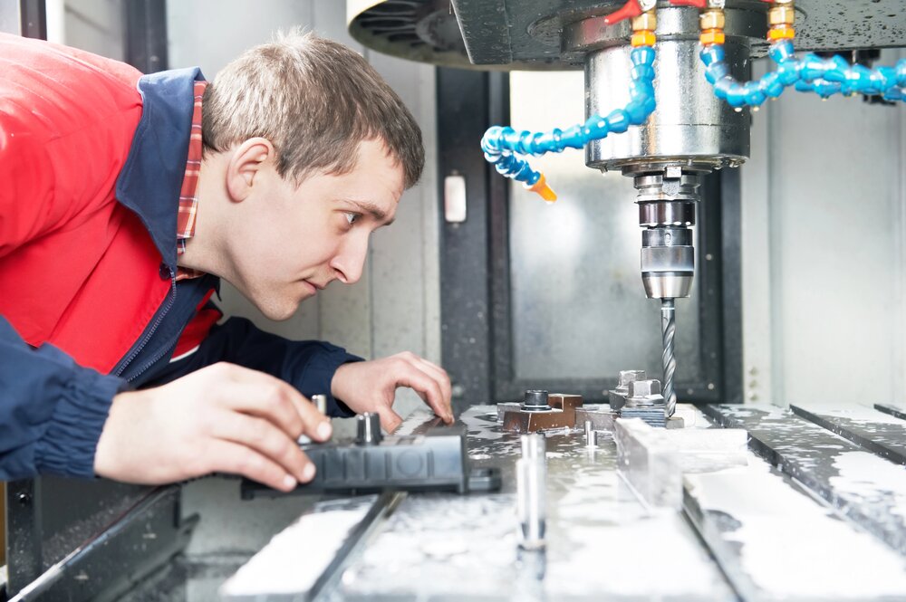 CNC milling operator at control panel